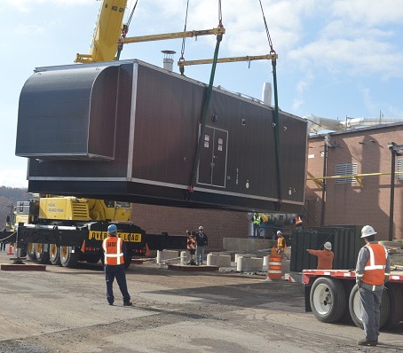 CHP system outside plant with workers around