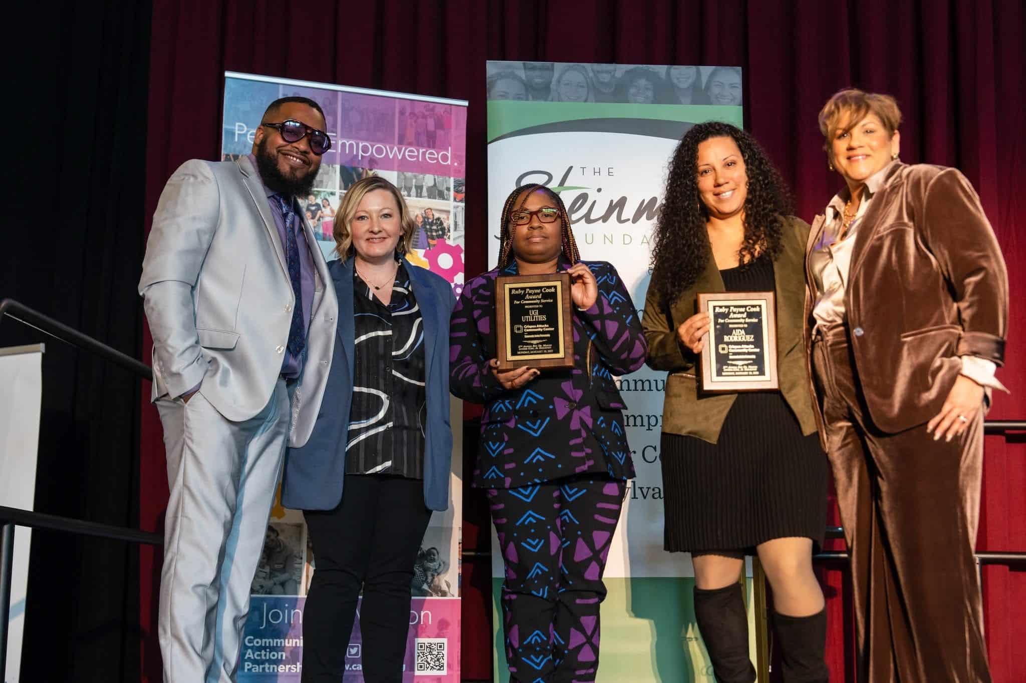 UGI employees standing on stage after accepting the award from Crispus Attucks Community Center.